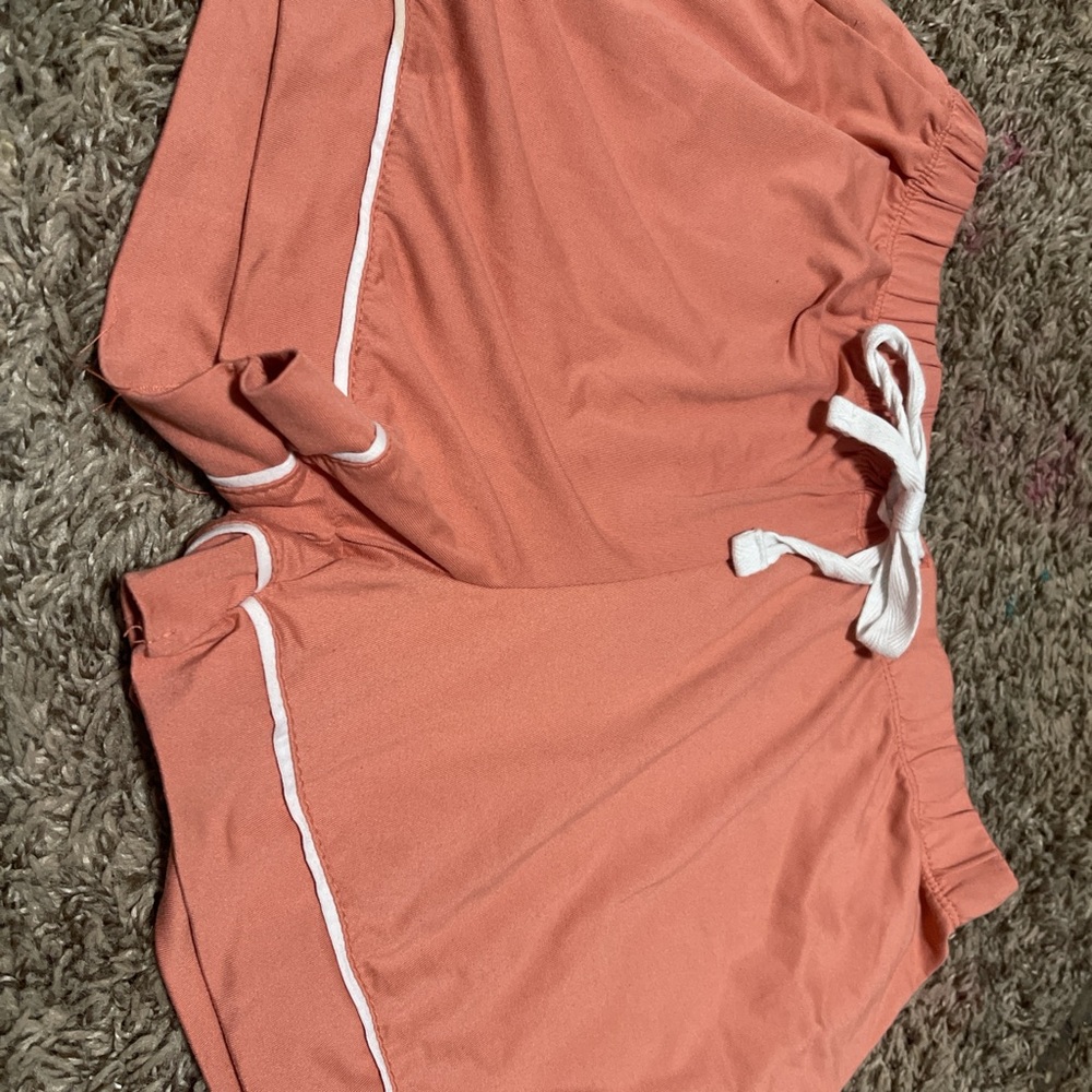 Born pajama set, comfy, spandex and polyester, stretchy, peachy colored